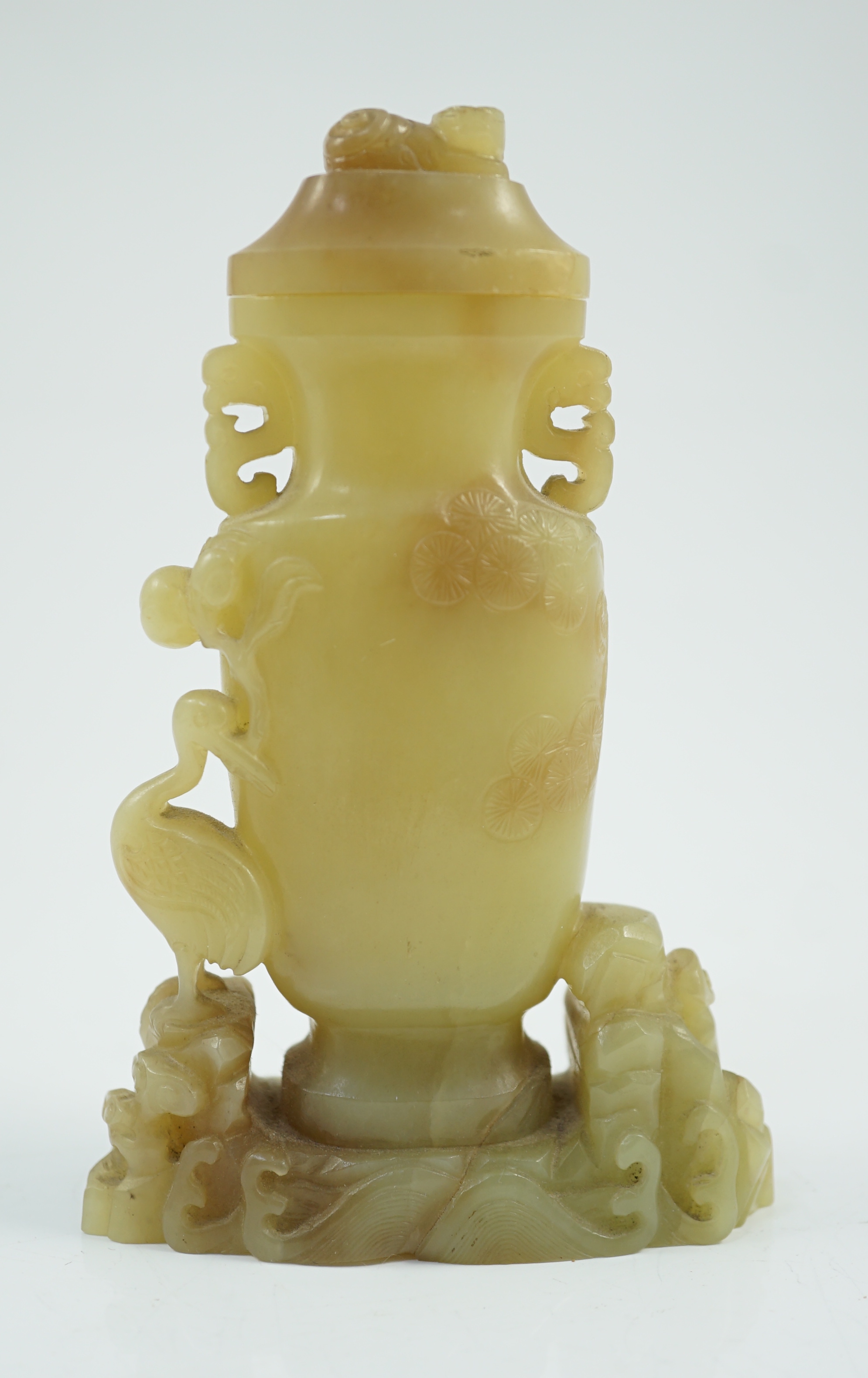 A Chinese yellow and russet jade vase and cover, 19th/20th century